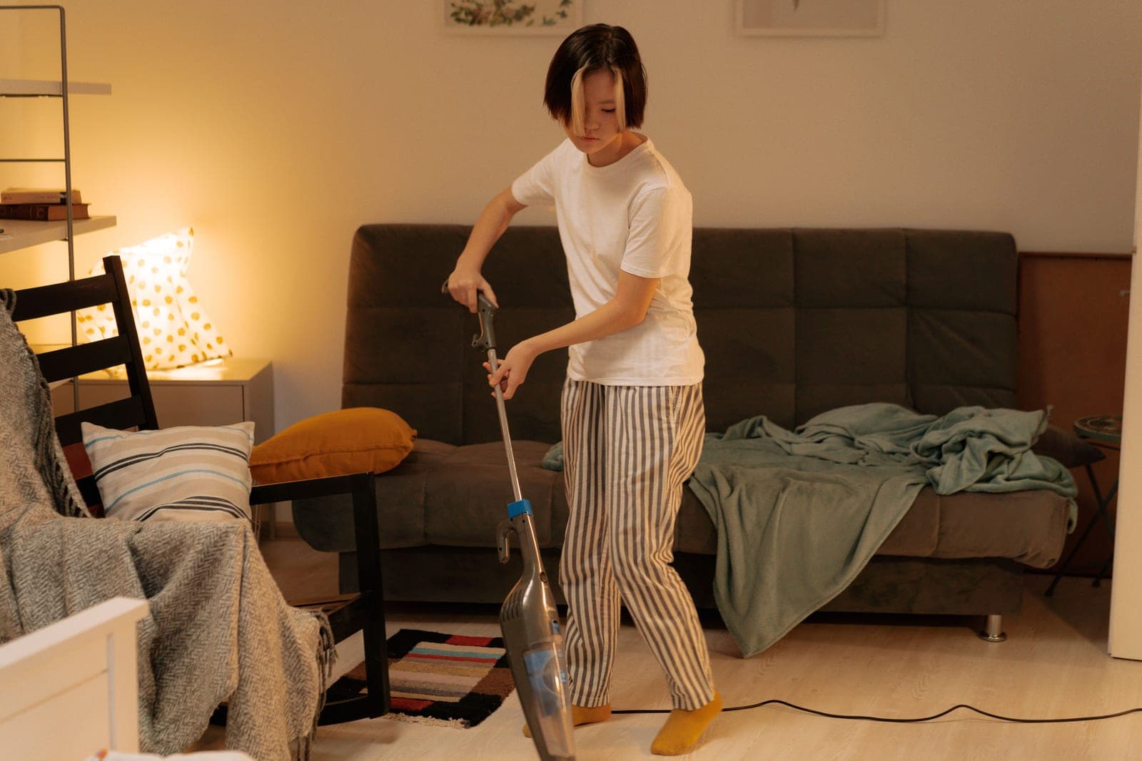 A person cleaning a floor at home