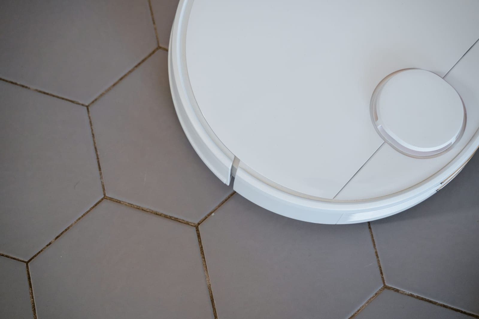 A close-up of a robot vacuum cleaner